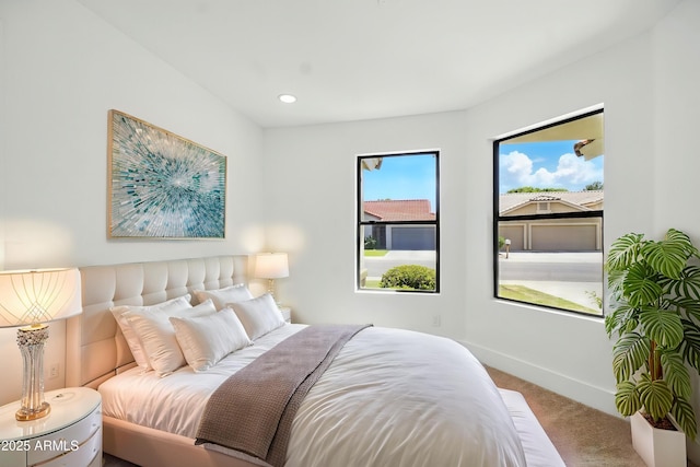 bedroom featuring baseboards and carpet floors