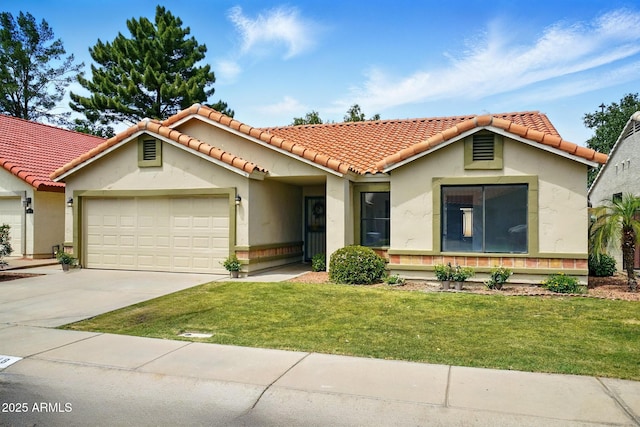 mediterranean / spanish house with a front lawn, concrete driveway, stucco siding, a tile roof, and a garage