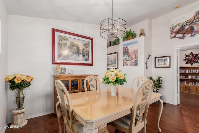 dining space featuring a notable chandelier and dark wood-type flooring