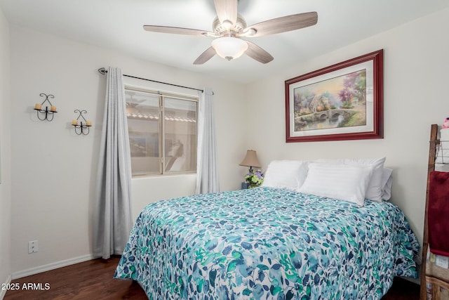 bedroom featuring dark hardwood / wood-style floors and ceiling fan