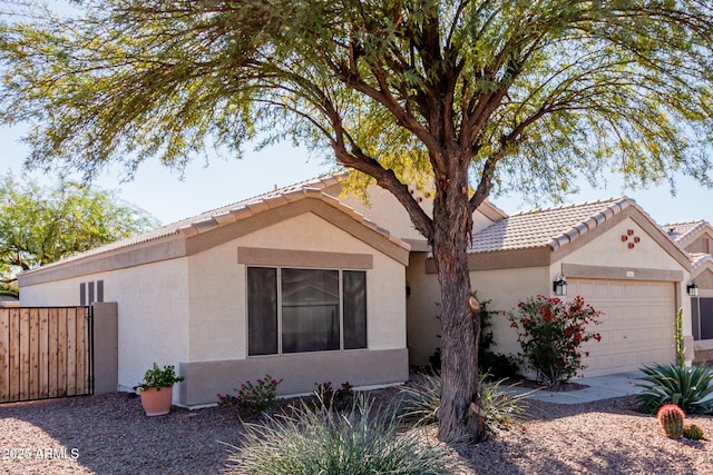 ranch-style house featuring a garage