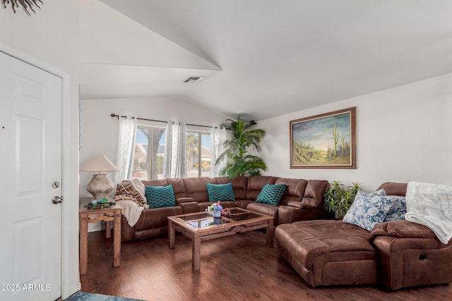 living room featuring lofted ceiling and dark hardwood / wood-style flooring