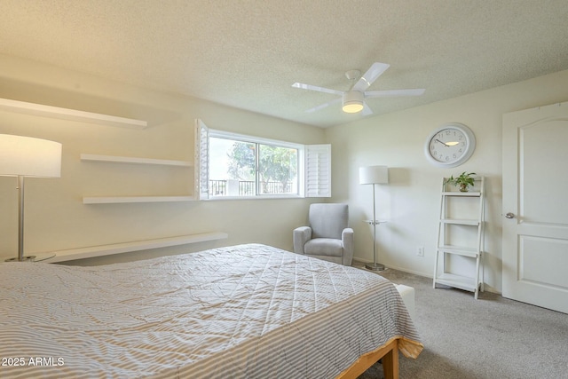 carpeted bedroom with baseboards, a ceiling fan, and a textured ceiling