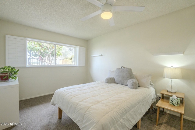 carpeted bedroom featuring ceiling fan, a textured ceiling, and baseboards