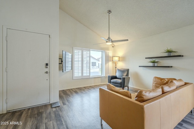 interior space with a textured ceiling, high vaulted ceiling, ceiling fan, and wood finished floors