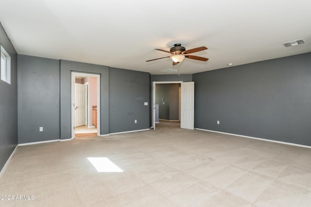 carpeted empty room with ceiling fan