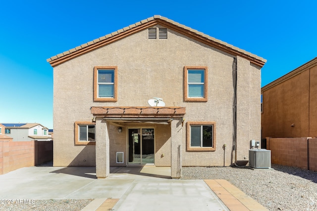 back of property with a patio and central air condition unit