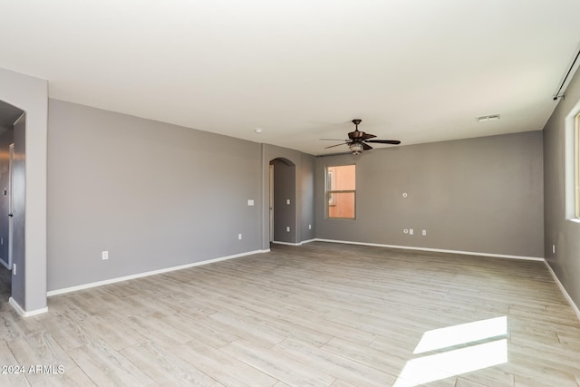 empty room featuring ceiling fan and light hardwood / wood-style floors