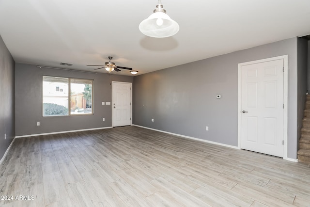 spare room featuring ceiling fan and light hardwood / wood-style floors