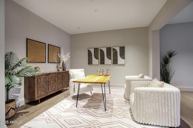 office area featuring light wood-style flooring and baseboards