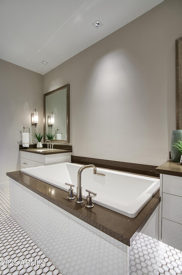 full bathroom with a sink and a bath