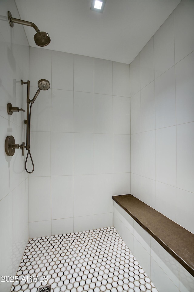 full bath featuring tiled shower