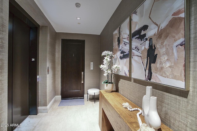 entrance foyer featuring light tile patterned floors and baseboards