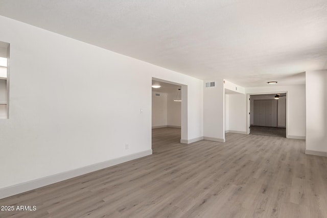 unfurnished room featuring light wood-type flooring