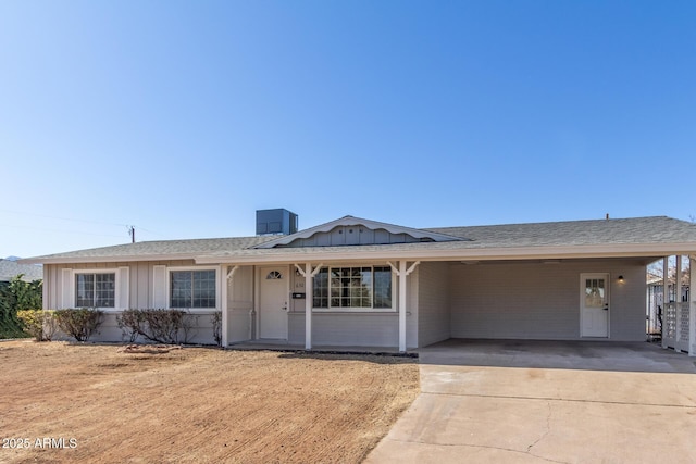 ranch-style house featuring a carport