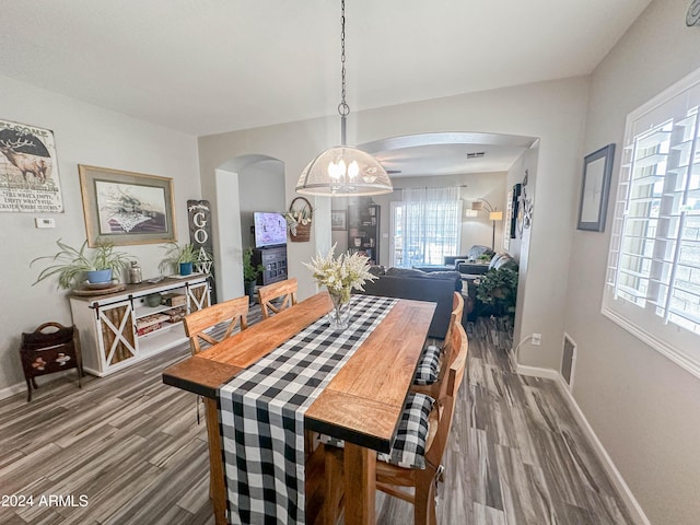 dining room with dark hardwood / wood-style flooring