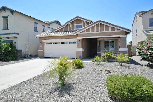 view of front of property with a garage and a porch