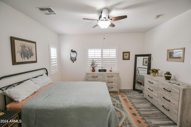 bedroom featuring hardwood / wood-style floors and ceiling fan