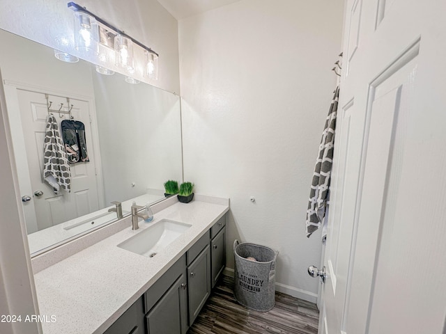 bathroom with vanity and hardwood / wood-style floors