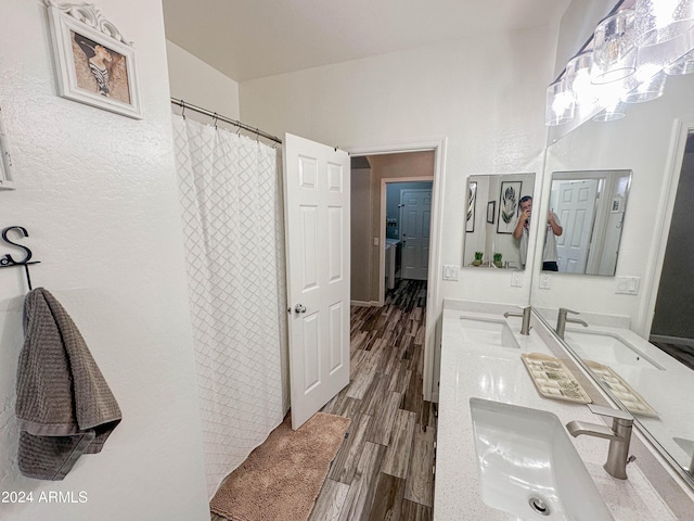 bathroom with vanity, hardwood / wood-style floors, and curtained shower