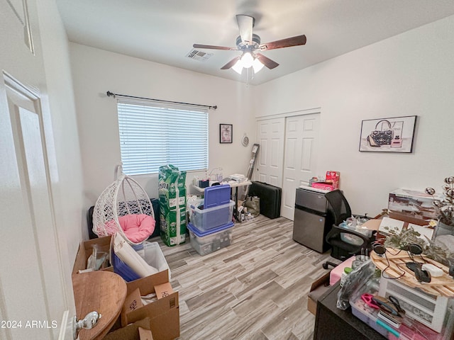 interior space featuring ceiling fan and light wood-type flooring