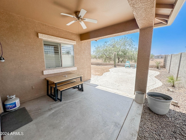 view of patio featuring ceiling fan