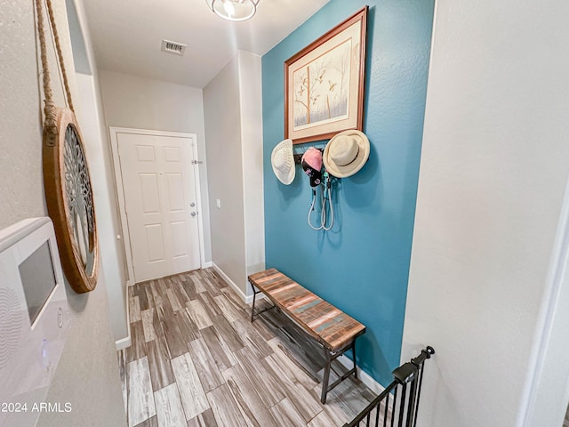 corridor featuring hardwood / wood-style floors