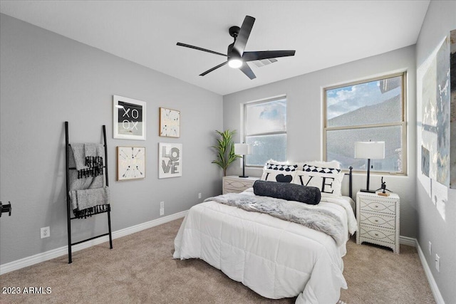 carpeted bedroom featuring ceiling fan