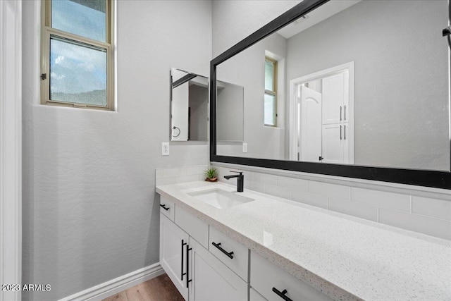 bathroom featuring vanity and wood-type flooring