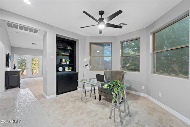 office space with light carpet, ceiling fan, and french doors