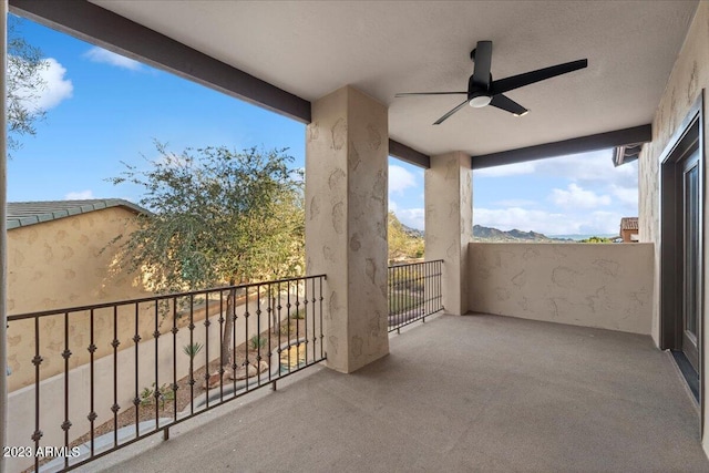 balcony featuring ceiling fan