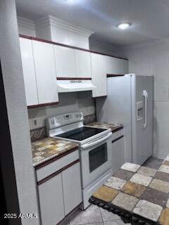 8055 E Thomas Rd Unit H103, Scottsdale, AZ 85251 - kitchen featuring white appliances, exhaust hood, white cabinetry, and crown molding