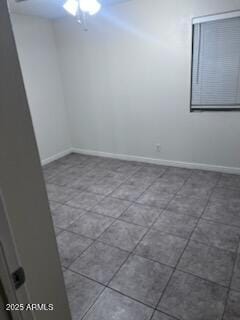 8055 E Thomas Rd Unit H103, Scottsdale, AZ 85251 - tiled empty room with baseboards