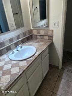 8055 E Thomas Rd Unit H103, Scottsdale, AZ 85251 - bathroom with vanity and tasteful backsplash