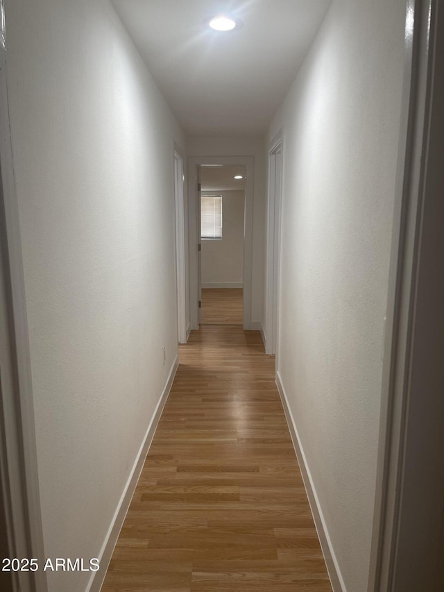 hallway featuring light wood-type flooring