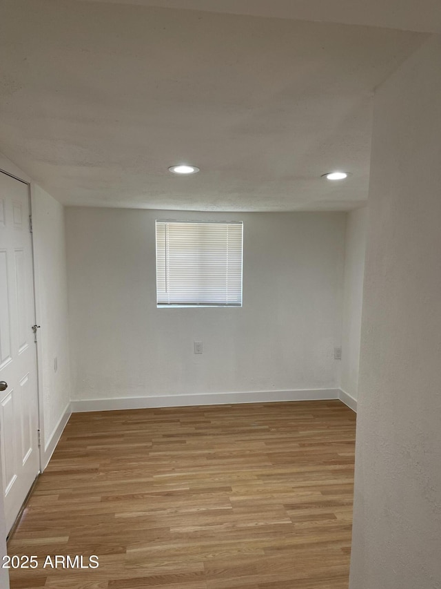 spare room with light hardwood / wood-style flooring