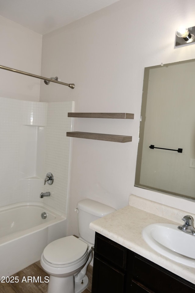 full bathroom featuring toilet, vanity, and shower / bathtub combination