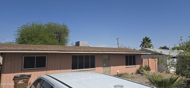 ranch-style house featuring a chimney