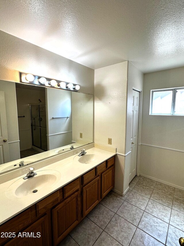 1836 N Stapley Dr Unit 88, Mesa, AZ 85203 - full bath with a textured ceiling, a stall shower, double vanity, and tile patterned floors