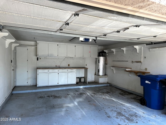 1836 N Stapley Dr Unit 88, Mesa, AZ 85203 - garage featuring a garage door opener, baseboards, and water heater