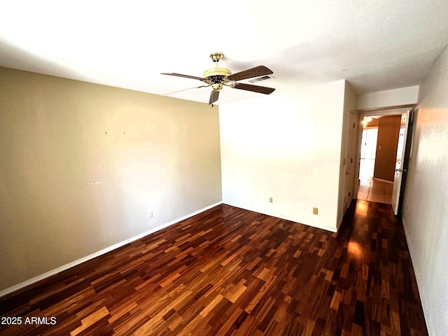 1836 N Stapley Dr Unit 88, Mesa, AZ 85203 - empty room with dark wood-style flooring, a ceiling fan, and baseboards