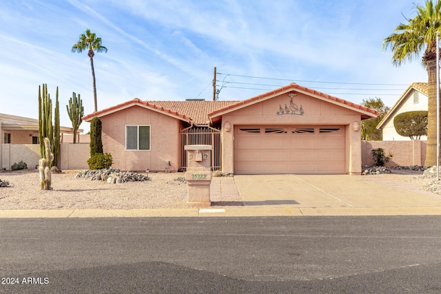 ranch-style home featuring a garage