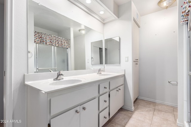 bathroom featuring tile patterned floors and vanity