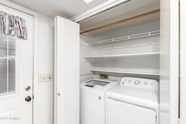 laundry room featuring washer and clothes dryer