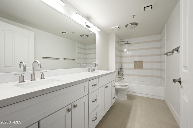 full bath with tile patterned floors, visible vents, double vanity, and a sink