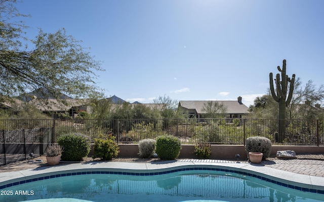 view of swimming pool featuring a fenced backyard and a fenced in pool