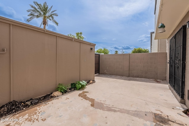 view of patio / terrace featuring fence