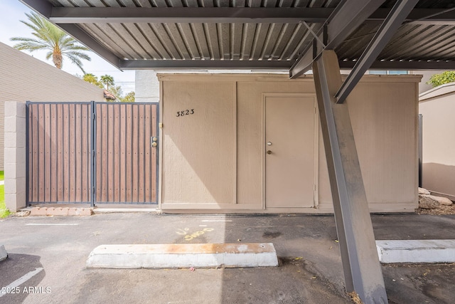 view of exterior entry with a gate