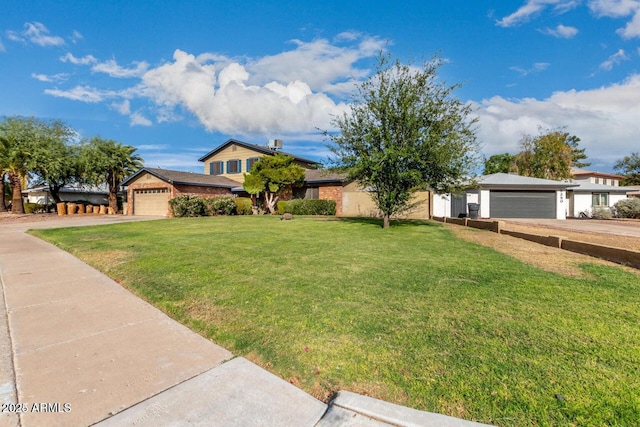 view of front facade with a garage and a front yard