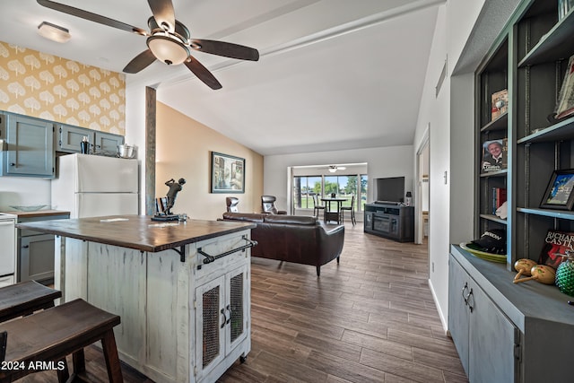 kitchen with white fridge, ceiling fan, vaulted ceiling, dark hardwood / wood-style floors, and wood counters